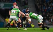 6 April 2024; Caelan Doris of Leinster is tackled by Leicester Tigers players Dan Cole, left, and Olly Cracknell during the Investec Champions Cup Round of 16 match between Leinster and Leicester Tigers at the Aviva Stadium in Dublin. Photo by Seb Daly/Sportsfile