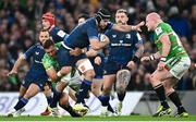 6 April 2024; Caelan Doris of Leinster is tackled by Hanro Liebenberg, left, and Dan Cole of Leicester Tigers during the Investec Champions Cup Round of 16 match between Leinster and Leicester Tigers at the Aviva Stadium in Dublin. Photo by Ramsey Cardy/Sportsfile