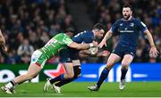 6 April 2024; Hugo Keenan of Leinster is tackled by Dan Kelly of Leicester Tigers during the Investec Champions Cup Round of 16 match between Leinster and Leicester Tigers at the Aviva Stadium in Dublin. Photo by Ramsey Cardy/Sportsfile