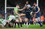 6 April 2024; Jack van Poortvliet of Leicester Tigers kicks under pressure from Andrew Porter of Leinster during the Investec Champions Cup Round of 16 match between Leinster and Leicester Tigers at the Aviva Stadium in Dublin. Photo by Ramsey Cardy/Sportsfile