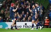 6 April 2024; Jamison Gibson-Park of Leinster celebrates with team-mate Josh van der Flier, left, after scoring their side's second try during the Investec Champions Cup Round of 16 match between Leinster and Leicester Tigers at the Aviva Stadium in Dublin. Photo by Ramsey Cardy/Sportsfile