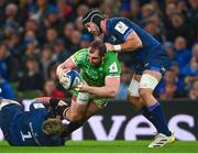 6 April 2024; James Cronin of Leicester Tigers is tackled by Andrew Porter, left, and Caelan Doris of Leinster during the Investec Champions Cup Round of 16 match between Leinster and Leicester Tigers at the Aviva Stadium in Dublin. Photo by Tyler Miller/Sportsfile