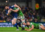 6 April 2024; Robbie Henshaw of Leinster is tackled by Jack van Poortvliet, bottom, and Harry Wells of Leicester Tigers during the Investec Champions Cup Round of 16 match between Leinster and Leicester Tigers at the Aviva Stadium in Dublin. Photo by Tyler Miller/Sportsfile
