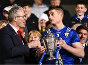 6 April 2024; Uachtarán Chumann Lúthchleas Gael Jarlath Burns presents the Clare captain Conor Cleary with the trophy after the Allianz Hurling League Division 1 final match between Clare and Kilkenny at FBD Semple Stadium in Thurles, Tipperary. Photo by Piaras Ó Mídheach/Sportsfile