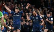 6 April 2024; Leinster players, from left, Ross Byrne, Jamison Gibson-Park and Hugo Keenan celebrate a try, scored by Jack Conan, which was subsequently disallowed, during the Investec Champions Cup Round of 16 match between Leinster and Leicester Tigers at the Aviva Stadium in Dublin. Photo by Ramsey Cardy/Sportsfile