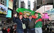 6 April 2024; Mayo supporters, from left, Miriam and Matthew Turner, both originally from Doohoma in Mayo, with Liam Harbison and his son Donnacha, from Termonfeckin in Louth, at Times Square before the Connacht GAA Football Senior Championship quarter-final match between New York and Mayo at Gaelic Park in New York, USA. Photo by Sam Barnes/Sportsfile