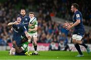 6 April 2024; Ryan Baird of Leinster ofloads to Jack Conan to setup their sid's fifth try during the Investec Champions Cup Round of 16 match between Leinster and Leicester Tigers at the Aviva Stadium in Dublin. Photo by Ramsey Cardy/Sportsfile
