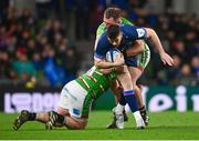 6 April 2024; Harry Byrne of Leinster is tackled by Julian Montoya, left, and Will Hurd of Leicester Tigers during the Investec Champions Cup Round of 16 match between Leinster and Leicester Tigers at the Aviva Stadium in Dublin. Photo by Tyler Miller/Sportsfile
