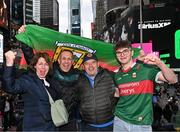6 April 2024; Mayo supporters, from left, Miriam and Matthew Turner, both originally from Doohoma in Mayo, with Liam Harbison and his son Donnacha, from Termonfeckin in Louth, at Times Square before the Connacht GAA Football Senior Championship quarter-final match between New York and Mayo at Gaelic Park in New York, USA. Photo by Sam Barnes/Sportsfile