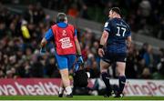 6 April 2024; Cian Healy of Leinster leaves the pitch with Leinster head of medical Professor John Ryan during the Investec Champions Cup Round of 16 match between Leinster and Leicester Tigers at the Aviva Stadium in Dublin. Photo by Ramsey Cardy/Sportsfile