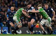 6 April 2024; Rónan Kelleher of Leinster is tackled by Finn Carnduff and Harry Wells of Leicester Tigers during the Investec Champions Cup Round of 16 match between Leinster and Leicester Tigers at the Aviva Stadium in Dublin. Photo by Ramsey Cardy/Sportsfile
