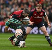 7 April 2024; Peter O’Mahony of Munster is tackled by Sam Graham of Northampton Saints during the Investec Champions Cup Round of 16 match between Northampton Saints and Munster at cinch Stadium at Franklin’s Gardens in Northampton, England. Photo by Brendan Moran/Sportsfile