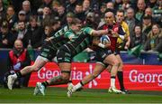 7 April 2024;Simon Zebo of Munster is tackled by Tommy Freeman and Lewis Ludlam of Northampton Saints during the Investec Champions Cup Round of 16 match between Northampton Saints and Munster at cinch Stadium at Franklin’s Gardens in Northampton, England. Photo by Brendan Moran/Sportsfile