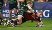 7 April 2024; Mike Haley of Munster scores his side's second try despite the tackle of Fin Smith of Northampton Saints during the Investec Champions Cup Round of 16 match between Northampton Saints and Munster at cinch Stadium at Franklin’s Gardens in Northampton, England. Photo by Brendan Moran/Sportsfile