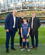 6 April 2024; Leinster players, from left, Rhys Ruddock, Rob Russell, and Tommy O'Brien with mascot Ross connolly, age 11, Booterstown, Dublin, before the Investec Champions Cup Round of 16 match between Leinster and Leicester Tigers at the Aviva Stadium in Dublin. Photo by Seb Daly/Sportsfile