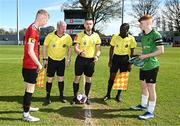 7 April 2024; Referee Dean Stenson with Malahide United captain Liam Walsh, left, and Peamount United captain Ciarán Gilmore before the FAI Under 17 Cup final match between Malahide United and Peamount United at Whitehall Stadium in Dublin. Photo by Seb Daly/Sportsfile