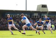 7 April 2024; Tom O'Connell of Waterford in action against Tipperary players, from left, Jimmy Feehan, Tadhg Condon, and Paudie Feehan during the Munster GAA Football Senior Championship quarter-final match between Waterford and Tipperary at Fraher Field in Dungarvan, Waterford. Photo by Michael P Ryan/Sportsfile