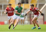 7 April 2024; Tommy Childs of Limerick in action against Colm O'Callaghan, left, and Paul Walsh of Cork during the Munster GAA Football Senior Championship quarter-final match between Cork and Limerick at SuperValu Páirc Ui Chaoimh in Cork. Photo by Tom Beary/Sportsfile