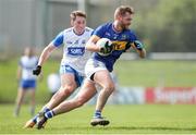 7 April 2024; Colm O'Shaughnessy of Tipperary in action against James Power of Waterford during the Munster GAA Football Senior Championship quarter-final match between Waterford and Tipperary at Fraher Field in Dungarvan, Waterford. Photo by Michael P Ryan/Sportsfile