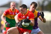 7 April 2024; Mikey Bambrick of Carlow in action against Liam Coleman of Wexford during the Leinster GAA Football Senior Championship Round 1 match between Wexford and Carlow at Chadwicks Wexford Park in Wexford. Photo by Tyler Miller/Sportsfile