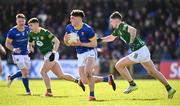 7 April 2024; Oisín O'Toole of Longford is tackled by Cathal Hickey of Meath  during the Leinster GAA Football Senior Championship Round 1 match between Longford and Meath at Glennon Brothers Pearse Park in Longford. Photo by Ray McManus/Sportsfile