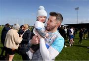 7 April 2024; Waterford goalkeeper Paudie Hunt celebrates with his 8 month old son Daithí after the Munster GAA Football Senior Championship quarter-final match between Waterford and Tipperary at Fraher Field in Dungarvan, Waterford. Photo by Michael P Ryan/Sportsfile