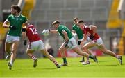 7 April 2024; Cormac Woulfe of Limerick in action against Tommy Walsh of Cork during the Munster GAA Football Senior Championship quarter-final match between Cork and Limerick at SuperValu Páirc Ui Chaoimh in Cork. Photo by Tom Beary/Sportsfile