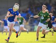 7 April 2024; Oisín O'Toole of Longford passes under pressure from Cathal Hickey of Meath  during the Leinster GAA Football Senior Championship Round 1 match between Longford and Meath at Glennon Brothers Pearse Park in Longford. Photo by Ray McManus/Sportsfile