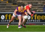 7 April 2024; Dylan Furlong of Wexford in action against Mark Furey of Carlow during the Leinster GAA Football Senior Championship Round 1 match between Wexford and Carlow at Chadwicks Wexford Park in Wexford. Photo by Tyler Miller/Sportsfile