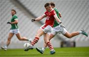 7 April 2024; Conor Corbett of Cork has a shot at goal despite the attempts of Cillian Fahy of Limerick during the Munster GAA Football Senior Championship quarter-final match between Cork and Limerick at SuperValu Páirc Ui Chaoimh in Cork. Photo by Tom Beary/Sportsfile