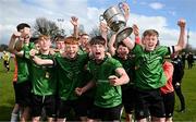 7 April 2024; Peamount United captains Ciarán Gilmore, left, and Conor Quinn, right, celebrate with teammates and the trophy after their side's victory in the FAI Under 17 Cup final match between Malahide United and Peamount United at Whitehall Stadium in Dublin. Photo by Seb Daly/Sportsfile
