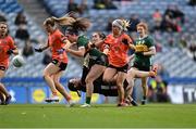 7 April 2024; Armagh goalkeeper Anna Carr is knocked to the ground as Emma Dineen of Kerry bears down on goal during the Lidl LGFA National League Division 1 final match between Armagh and Kerry at Croke Park in Dublin. Photo by Stephen Marken/Sportsfile