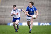 7 April 2024; Oisin Kiernan of Cavan in action against David Garland of Monaghan during the Ulster GAA Football Senior Championship preliminary round match between Monaghan and Cavan at St Tiernach's Park in Clones, Monaghan. Photo by Ramsey Cardy/Sportsfile