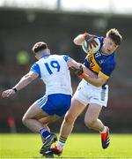 7 April 2024; Emmet Moloney of Tipperary in action against Conor O' Cuirrín of Waterford during the Munster GAA Football Senior Championship quarter-final match between Waterford and Tipperary at Fraher Field in Dungarvan, Waterford. Photo by Michael P Ryan/Sportsfile