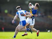 7 April 2024; Emmet Moloney of Tipperary in action against Conor O' Cuirrín of Waterford during the Munster GAA Football Senior Championship quarter-final match between Waterford and Tipperary at Fraher Field in Dungarvan, Waterford. Photo by Michael P Ryan/Sportsfile