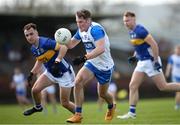 7 April 2024; James Power of Waterford in action against Tadhg Condon of Tipperary during the Munster GAA Football Senior Championship quarter-final match between Waterford and Tipperary at Fraher Field in Dungarvan, Waterford. Photo by Michael P Ryan/Sportsfile
