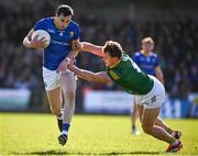 7 April 2024; Darren Gallagher of Longford is tackled by Ronan Jones of Meath during the Leinster GAA Football Senior Championship Round 1 match between Longford and Meath at Glennon Brothers Pearse Park in Longford. Photo by Ray McManus/Sportsfile