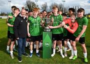 7 April 2024; FAI Board Member and Chairperson of the FAI Youth and Amateur Committee David Moran presents the trophy to Peamount United captains Ciarán Gilmore, left, and Conor Quinn after the FAI Under 17 Cup final match between Malahide United and Peamount United at Whitehall Stadium in Dublin. Photo by Seb Daly/Sportsfile