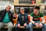 7 April 2024; Mayo supporters, from left, Sean McLoughlin from Foxford, John Gilmore from Foxford, and Dylan Coleman from Knockmore,  ride the number one subway before the Connacht GAA Football Senior Championship quarter-final match between New York and Mayo at Gaelic Park in New York, USA. Photo by Sam Barnes/Sportsfile