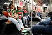 7 April 2024; Mayo supporters including Hannah Davidson from Foxford, left, and Emma Coleman from Knockmore, ride the number one subway before the Connacht GAA Football Senior Championship quarter-final match between New York and Mayo at Gaelic Park in New York, USA. Photo by Sam Barnes/Sportsfile