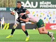 7 April 2024; Jale Vatubua of Section Paloise is tackled by Denis Buckley of Connacht during the Challenge Cup Round of 16 match between Section Paloise and Connacht at Stade du Hameau in Pau, France. Photo by Loic Cousin/Sportsfile