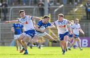 7 April 2024; Cian Reilly of Cavan in action against Gary Mohan, left, and Michael Hamill of Monaghan during the Ulster GAA Football Senior Championship preliminary round match between Monaghan and Cavan at St Tiernach's Park in Clones, Monaghan. Photo by Daire Brennan/Sportsfile