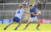7 April 2024; Oisin Brady of Cavan in action against Ryan O'Toole of Monaghan during the Ulster GAA Football Senior Championship preliminary round match between Monaghan and Cavan at St Tiernach's Park in Clones, Monaghan. Photo by Daire Brennan/Sportsfile