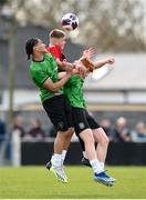 7 April 2024; Alex Cioch of Malahide United in action against Peamount United players Isaac Millington, centre, and Ciarán Gilmore during the FAI Under 17 Cup final match between Malahide United and Peamount United at Whitehall Stadium in Dublin. Photo by Seb Daly/Sportsfile
