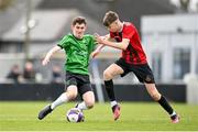 7 April 2024; Daniel Dreznjak of Malahide United is tackled by Donnacha McCarrick of Peamount United during the FAI Under 17 Cup final match between Malahide United and Peamount United at Whitehall Stadium in Dublin. Photo by Seb Daly/Sportsfile