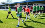 7 April 2024; Peamount United captain Ciarán Gilmore leads his side out before the FAI Under 17 Cup final match between Malahide United and Peamount United at Whitehall Stadium in Dublin. Photo by Seb Daly/Sportsfile