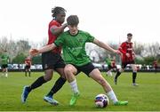 7 April 2024; Patrick Small of Peamount United in action against Ronald Quam Omoshonwon of Malahide United during the FAI Under 17 Cup final match between Malahide United and Peamount United at Whitehall Stadium in Dublin. Photo by Seb Daly/Sportsfile