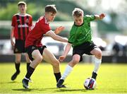 7 April 2024; Fionnán Galvin of Peamount United in action against Alex Jeal of Malahide United during the FAI Under 17 Cup final match between Malahide United and Peamount United at Whitehall Stadium in Dublin. Photo by Seb Daly/Sportsfile