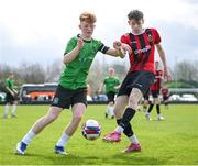 7 April 2024; Adam McCrum of Malahide United in action against Ciarán Gilmore of Peamount United during the FAI Under 17 Cup final match between Malahide United and Peamount United at Whitehall Stadium in Dublin. Photo by Seb Daly/Sportsfile
