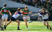 7 April 2024; Jack Carney of Mayo in action against James Walsh, left, and Tiernan Mathers of New York during the Connacht GAA Football Senior Championship quarter-final match between New York and Mayo at Gaelic Park in New York, USA. Photo by Sam Barnes/Sportsfile